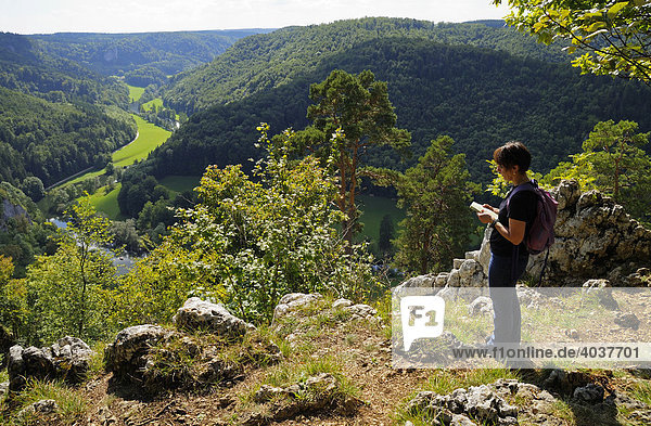 Woman enjoying the view  Upper Danube Nature Park  Donaubergland  Baden-Wuerttemberg  Germany  Europe