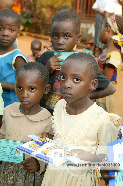 Children receiving school materials  Women's Education Centre  Bamenda  Cameroon  Africa