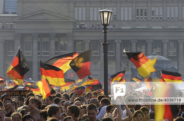 Soccer fans celebrating the German national soccer team with a sea of flags on Schlossplatz Square  Stuttgart  Baden-Wuerttemberg  Germany  Europe