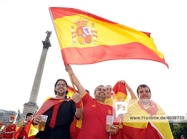 Fans of the Spanish national team with a flag celebrating on Schlossplatz Square in Stuttgart  Baden-Wuerttemberg  Germany  Europe