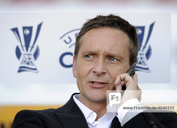 Manager Horst HELDT VfB Stuttgart on his mobile UEFA-Cup logo behind him Stuttgart Germany Europe