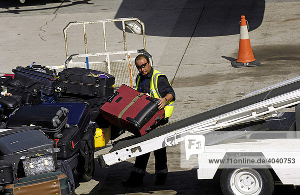 Baggage being loaded on the taxiway of Las Palmas Airport  Grand Canary  Canary Islands  Spain  Europe