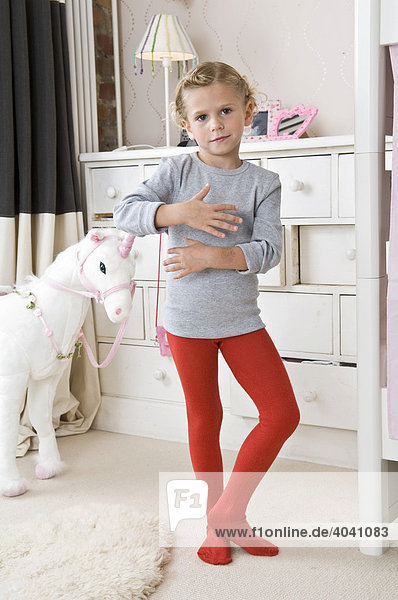 A girl in tights in the nursery