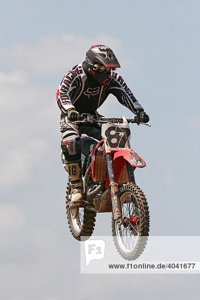 Motocross racer in mid jump  Wolfshausen  Hesse  Germany  Europe