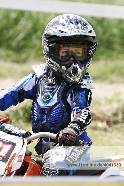 Child motocross rider in full protective gear  Wolfshausen  Hesse  Deutschland  Europe