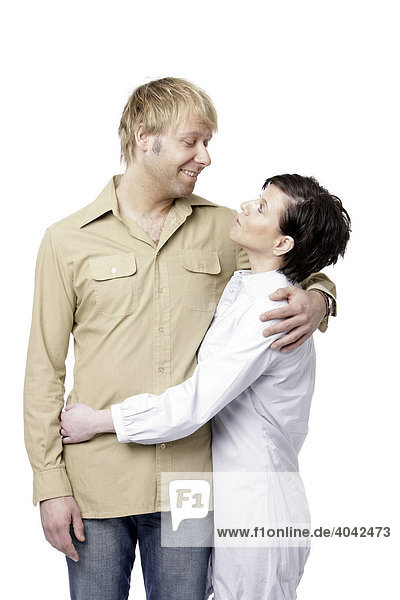 Dark-haired woman and blonde man embracing