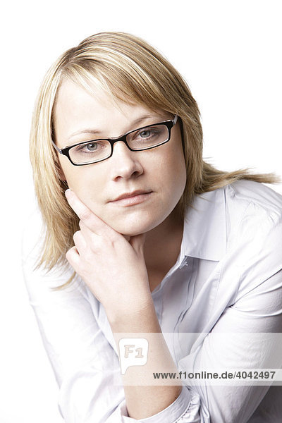 Blonde woman wearing a white blouse and glasses