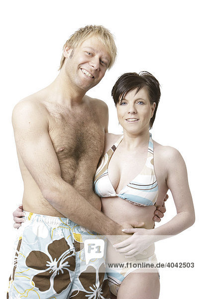 Blonde man and dark-haired woman wearing swimming costumes