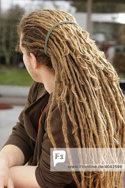 A man with rastafarian hair  dreadlocks  sidewards