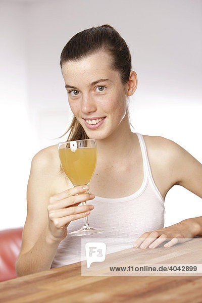 Girl with glass of fruit juice