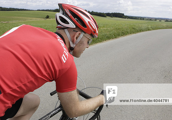 Racing cyclists wearing a helmet  Kleinhartpenning  Bavaria  Germany