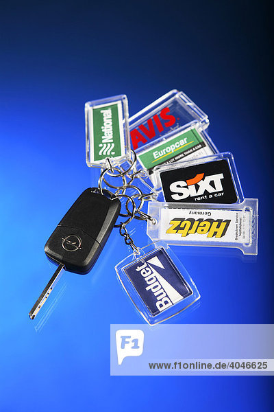 Car keys with key rings from various car rental companies