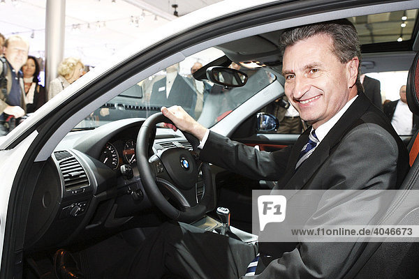 Guenther H. Oettinger  Premier of Baden-Wuerttemberg sitting in a BMW automobile