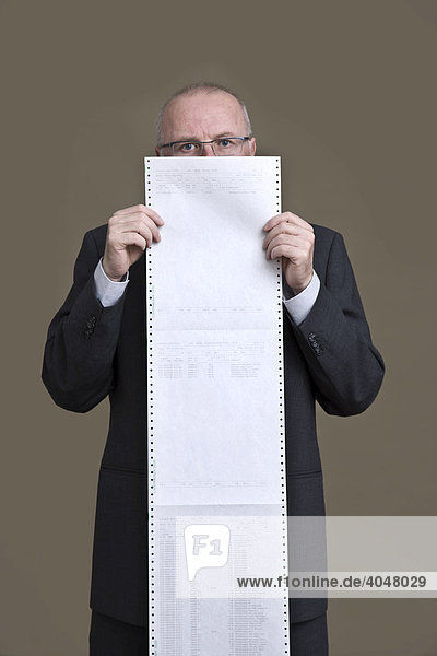 Businessman with stock-exchange papers