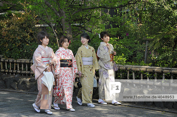 Japanese women wearing kimonos in the historic city centre of Kyoto  Japan  Asia