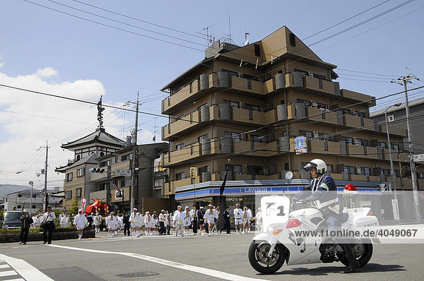Police closing off the traffic for the procession  Matsuri shrine festival of the Matsuo Taisha Shrine  shintoism  Kyoto  Japan  Asia