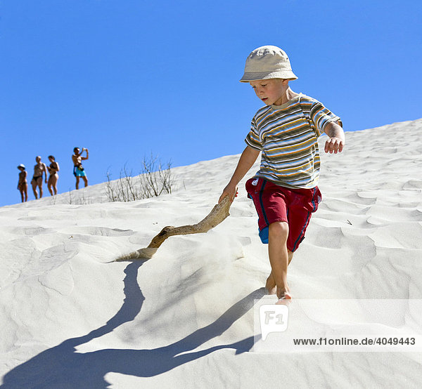 Boy  5 years  playing in the dunes of Porto Pino  Sardinia  Southern Coast  Italy  Europe