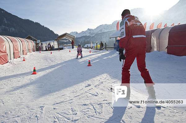 Children being taught by a ski instructor in a beginners course in a ski school  Ehrwald  Tyrol  Austria  Europe
