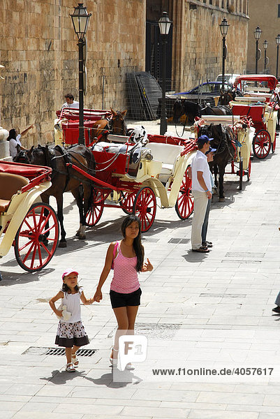 Horse-drawn carriages at the cathedral  La Seu Cathedral in the historic centre  Ciutat Antiga  Palma de Majorca  Balearic Islands  Spain  Europe