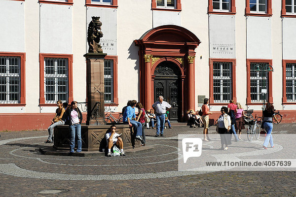 University museum  main entrance  students and tourists on the square in front of the university in the historic centre of Heidelberg  Neckar Valley  Baden-Wuerttemberg  Germany  Europe