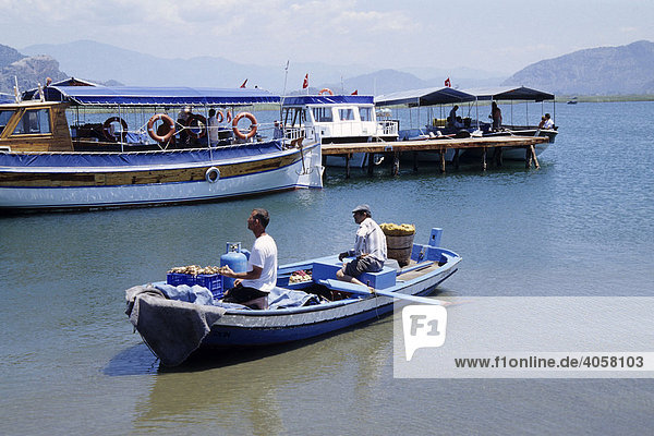 Seafood vendors  boats on the river  river delta near Kaunos  Dalyan in the Mugla Province  Turkey