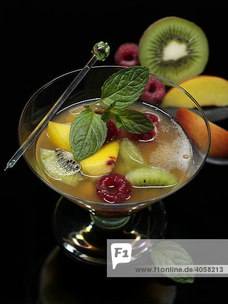 Nectarine  kiwi and raspberry punch in a glass