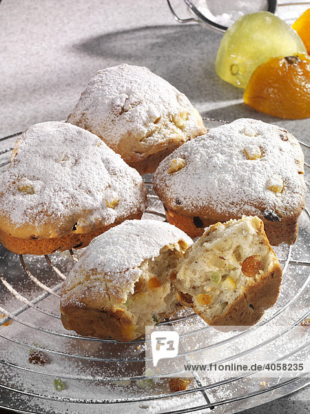 Heart-shaped Christmas Stollen with powder sugar on a baking rack