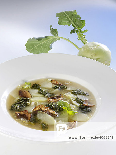Kohlrabi soup with mushrooms in a soup plate