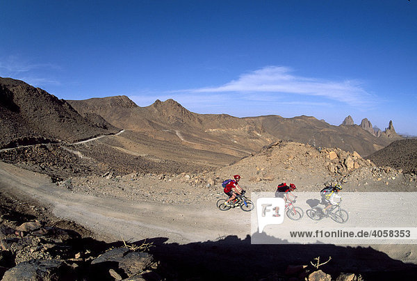 Mountainbikers  Ahaggar National Park  Assekrem  Ahaggar Mountains  Algeria  Africa