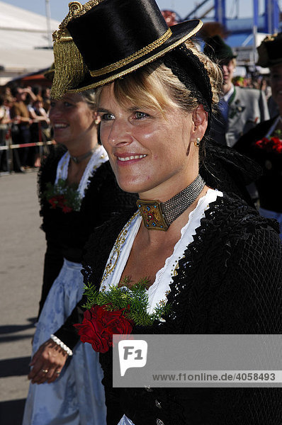 Woman wearing a traditional costume in a procession  Wies'n  Oktoberfest  Munich  Bavaria  Germany  Europe