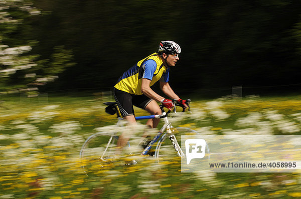 Racing cyclists near Schleching  Chiemgau  Bavaria  Germany  Europe