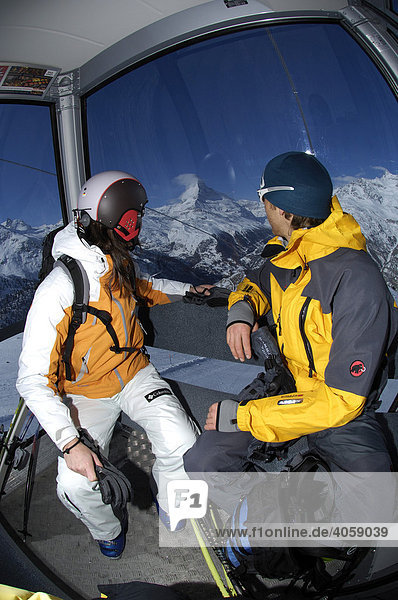 Skiers in the Rothorn gondola lift to the Blauherd Alpine Pasture  Mount Matterhorn  Zermatt  Wallis  Switzerland  Europe