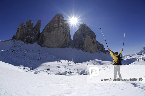 Snowshoeing in front of the mountain Drie Zinnen or Tre Cime di Lavaredo  Italian for Three Peaks of Lavaredo  Hochpustertal Valley or High Puster Valley or Alto Pusteria  Bolzano-Bozen  Dolomite Alps  Italy  Europe