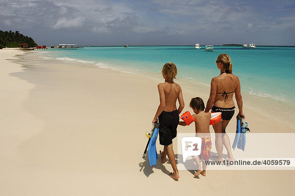 Woman and two children on the beach Laguna Resort  The Maldives  Indian Ocean