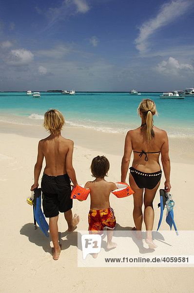 Woman and two children on the beach  Laguna Resort  The Maldives  Indian Ocean