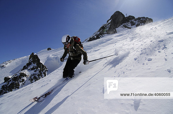 Ski wanderer on ski tour  ski-run from Tristkopf  Kelchsau  Tyrol  Austria  Europe