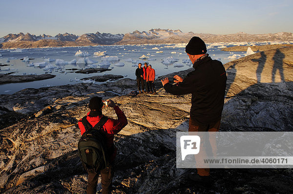 Hikers  trekking in the Sermilik-Fjord  East-Greenland  Greenland