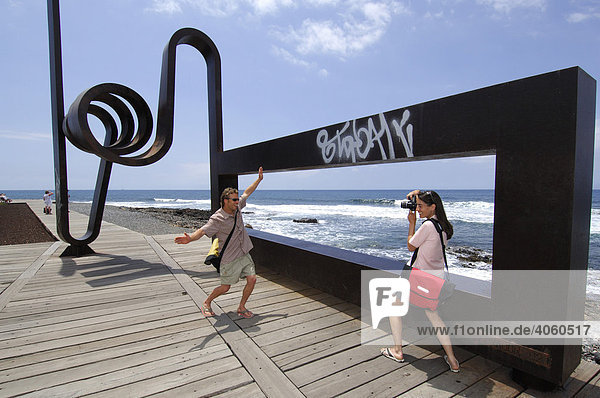 Vacationists taking photos of each other in Las Americas  Tenerife  Canary Islands  Spain  Europe