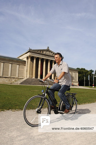 Best Ager  bicyclist  bike tour  Koenigsplatz Square  Munich  Bavaria  Germany  Europe