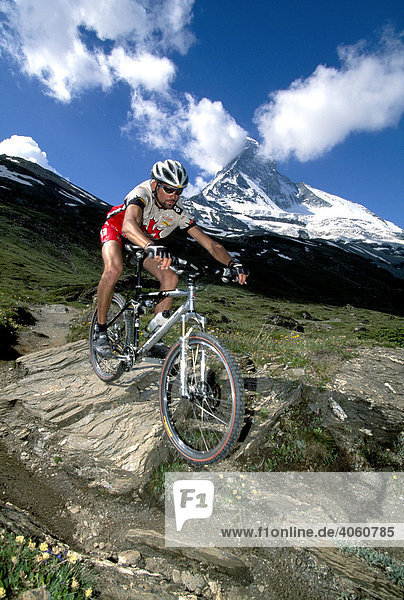Mountainbiker in front of Mt. Matterhorn  Zermatt  Wallis  Switzerland  Europe