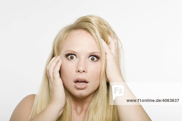 Young blonde woman  shocked expression