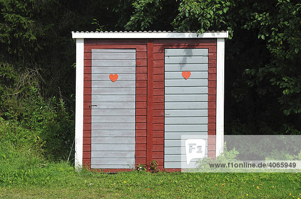 Toilet huts with hearts on the doors  Sweden  Scandinavia  Europe