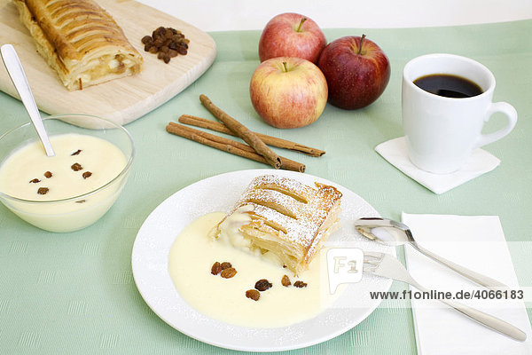 Apple strudel with vanilla sauce  cup of coffee and ingredients