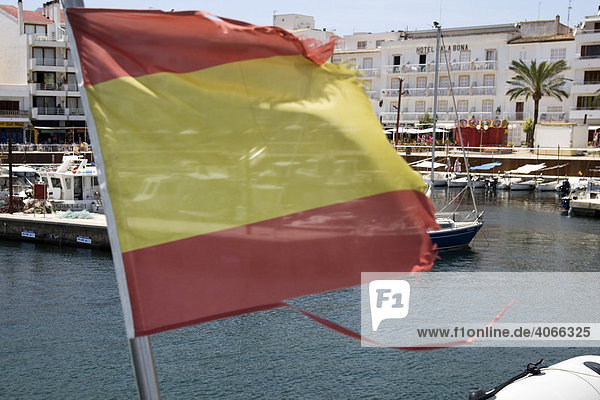 Spanish flag on a boat in the Cala Bona harbour  Majorca  Balearic Islands  Spain  Europe