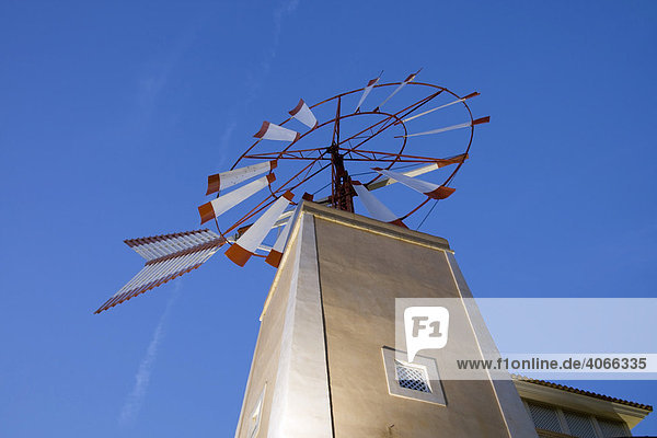 Wind wheel on a tower in Sa Coma  Majorca  Balearic Islands  Spain  Europe