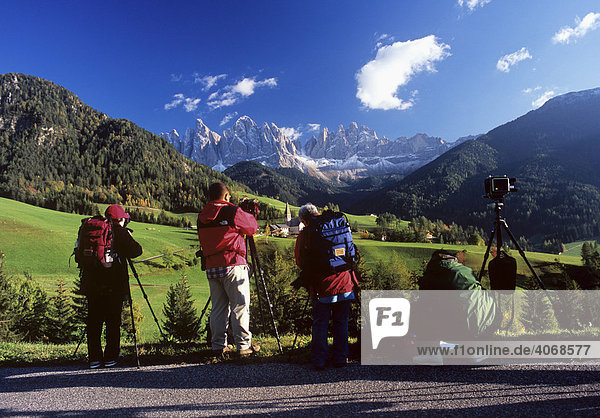 Japanese photographers in front of mountain panorama of the Geisler mountains  Bolzano-Bozen  Italy  Europe