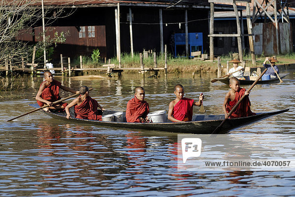 Five young monks in a boat  Inle Lake  Myanmar  Burma  South East Asia