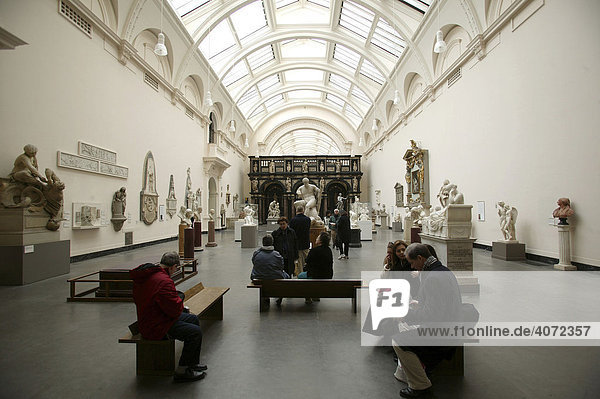Visitors viewing an exhibition with sculptures in the Victoria and Albert Museum in London  England  Great Britain  Europe