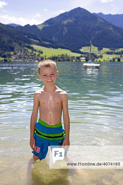 A boy  six years old  swimming in the Walchsee Lake  Tirol  Austria  Europe