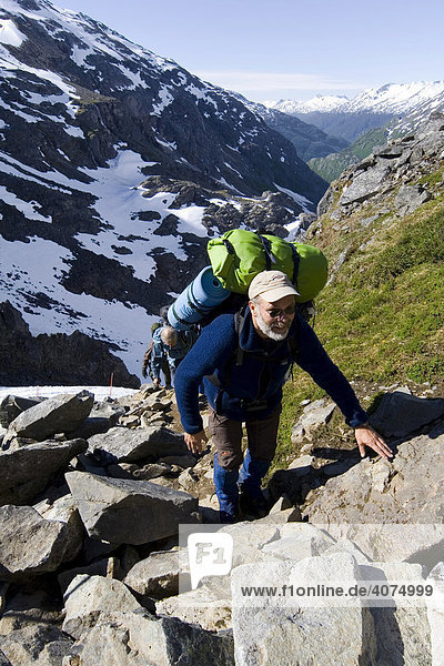 Hiker approaching the summit  Golden Stairs  Chilkoot Trail  Chilkoot Pass  Alaska  USA